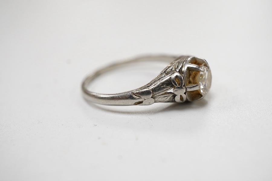 A white metal and claw set solitaire diamond ring, the stone weighing approx. 0.25ct, size N.